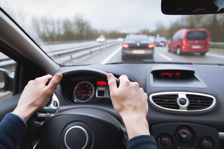 Person driving car on a highway