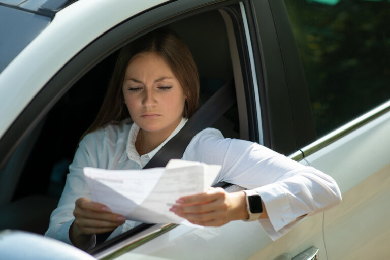 woman reviewing traffic ticket