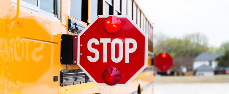 A school bus with the stop sign
