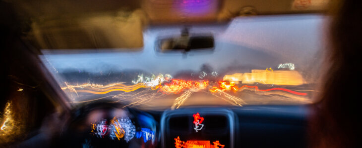 Blurred photo from inside a car at night